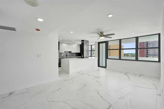 a view of an empty room with a window