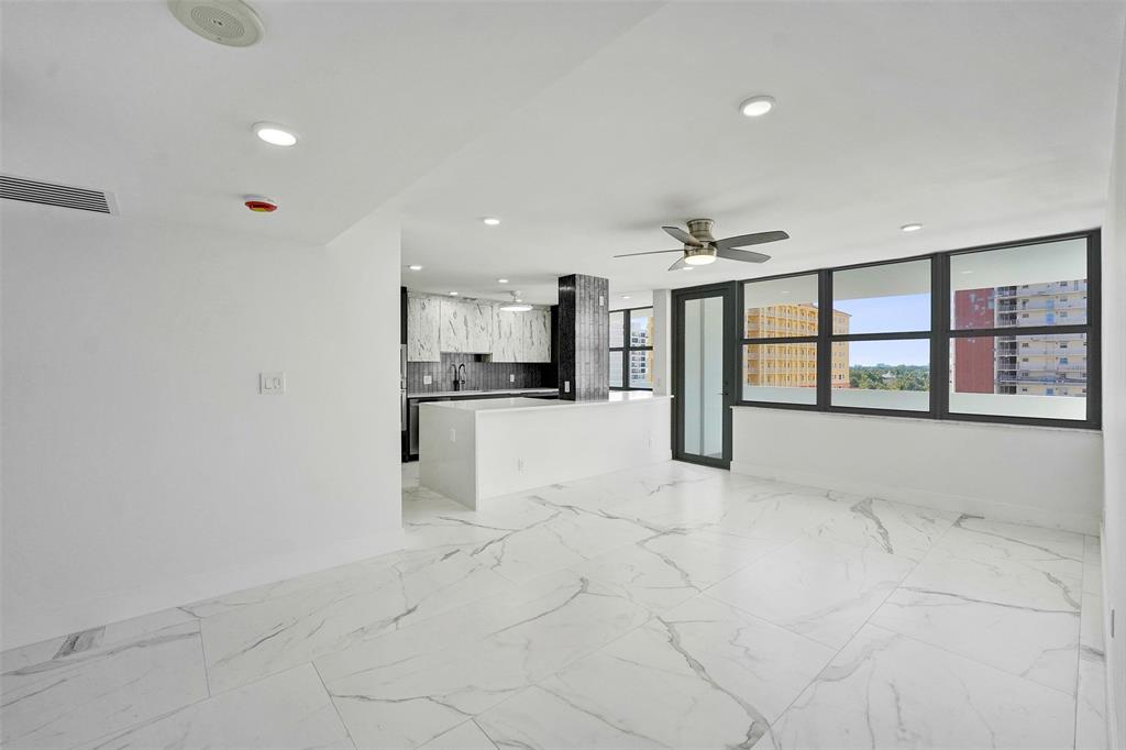 1390 South Ocean Boulevard, Unit 5C Pompano Beach, FL 33062 - Photo 15 of 35 a view of kitchen with refrigerator and white cabinets