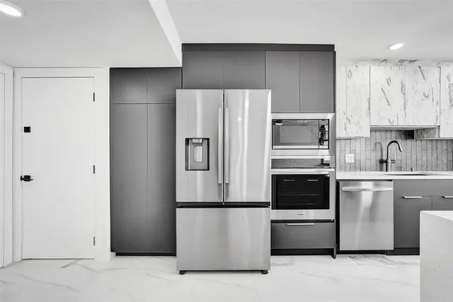 a spacious bathroom with a double vanity sink a mirror and a shower
