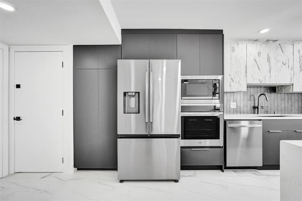 1390 South Ocean Boulevard, Unit 5C Pompano Beach, FL 33062 - Photo 18 of 35 a kitchen with cabinets and stainless steel appliances