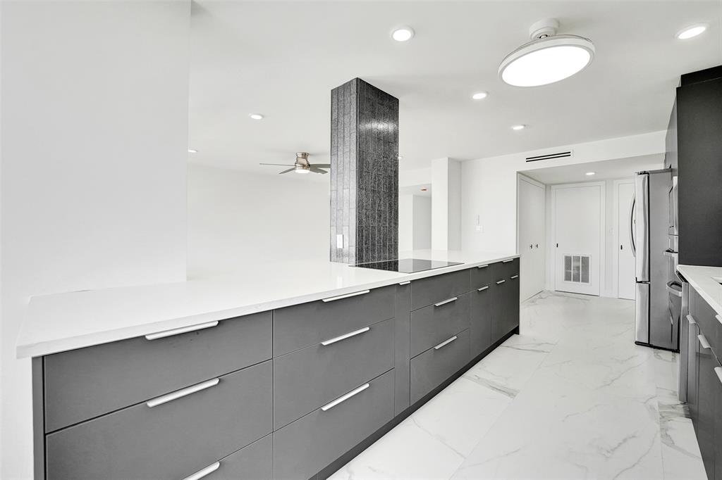 1390 South Ocean Boulevard, Unit 5C Pompano Beach, FL 33062 - Photo 19 of 35 a spacious bathroom with a double vanity sink a mirror and a shower