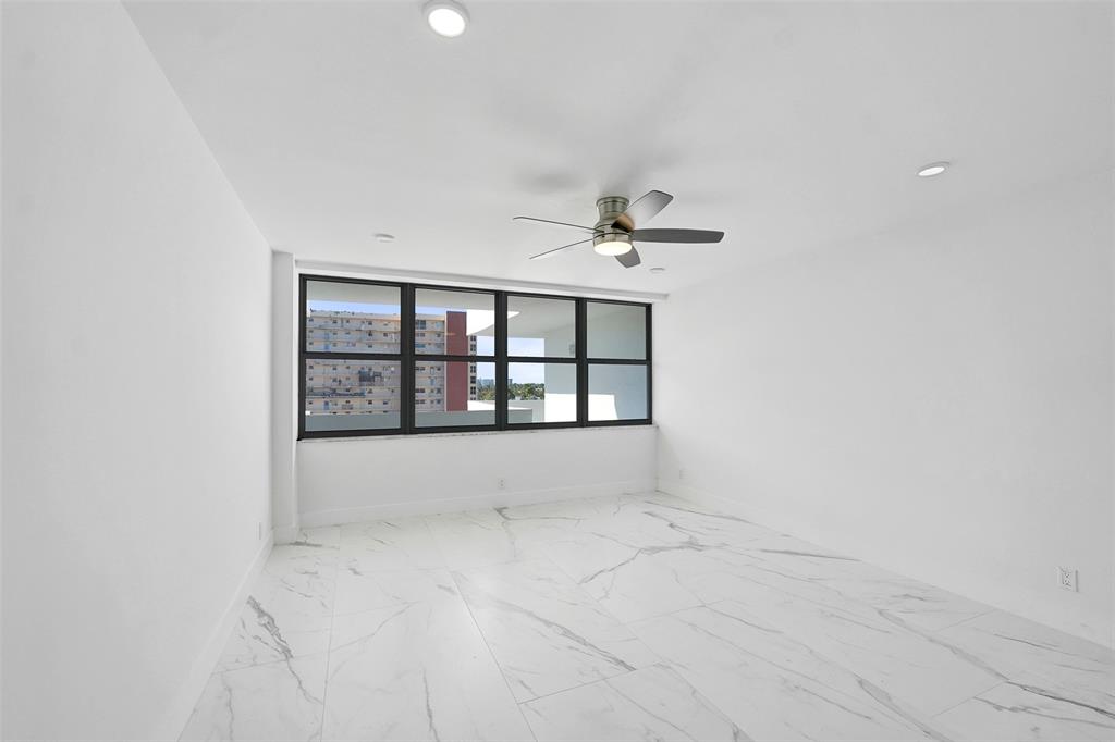 1390 South Ocean Boulevard, Unit 5C Pompano Beach, FL 33062 - Photo 27 of 35 a view of an empty room with a window