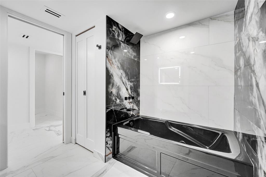 1390 South Ocean Boulevard, Unit 5C Pompano Beach, FL 33062 - Photo 31 of 35 a bathroom with a bathtub and shower