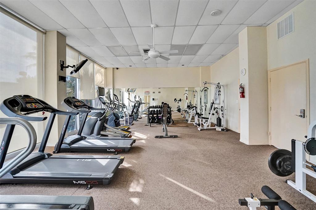 1390 South Ocean Boulevard, Unit 5C Pompano Beach, FL 33062 - Photo 32 of 35 a view of a room with gym equipment
