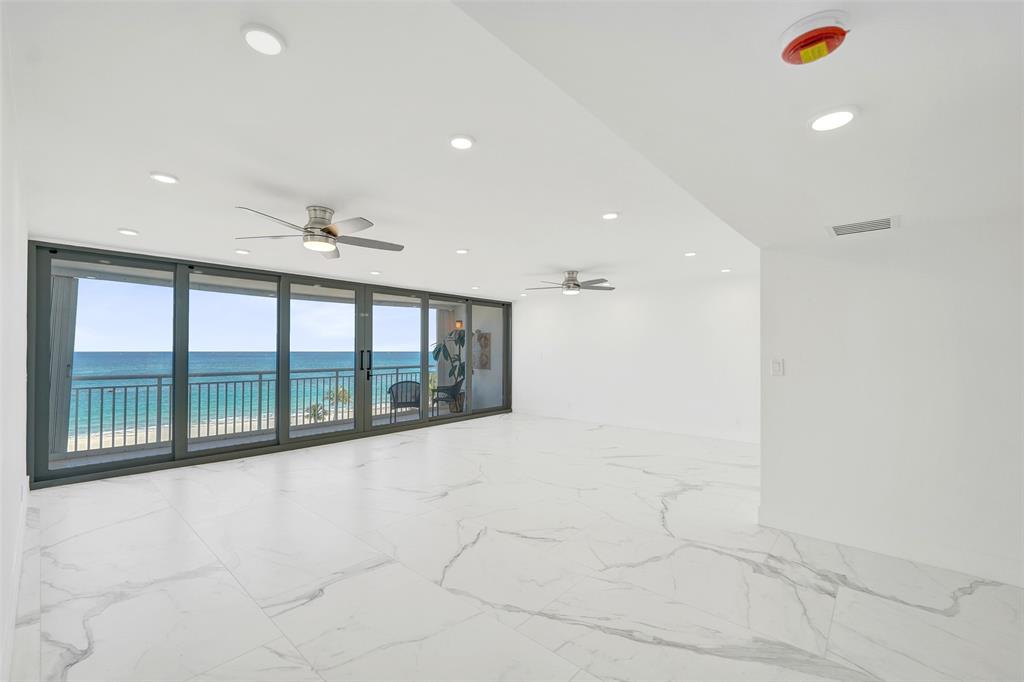 1390 South Ocean Boulevard, Unit 5C Pompano Beach, FL 33062 - Photo 10 of 35 a view of an empty room with a window