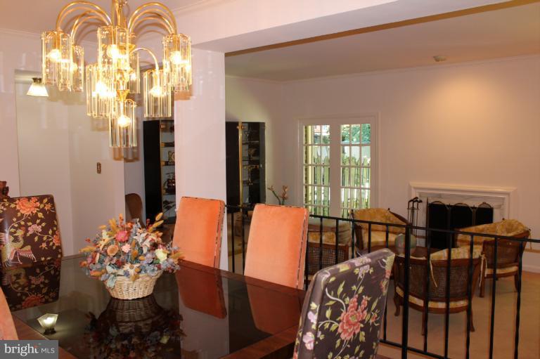 7312 Greentree Road Bethesda, MD 20817 - Photo 8 of 21 Looking from dining room into living room w/fpl