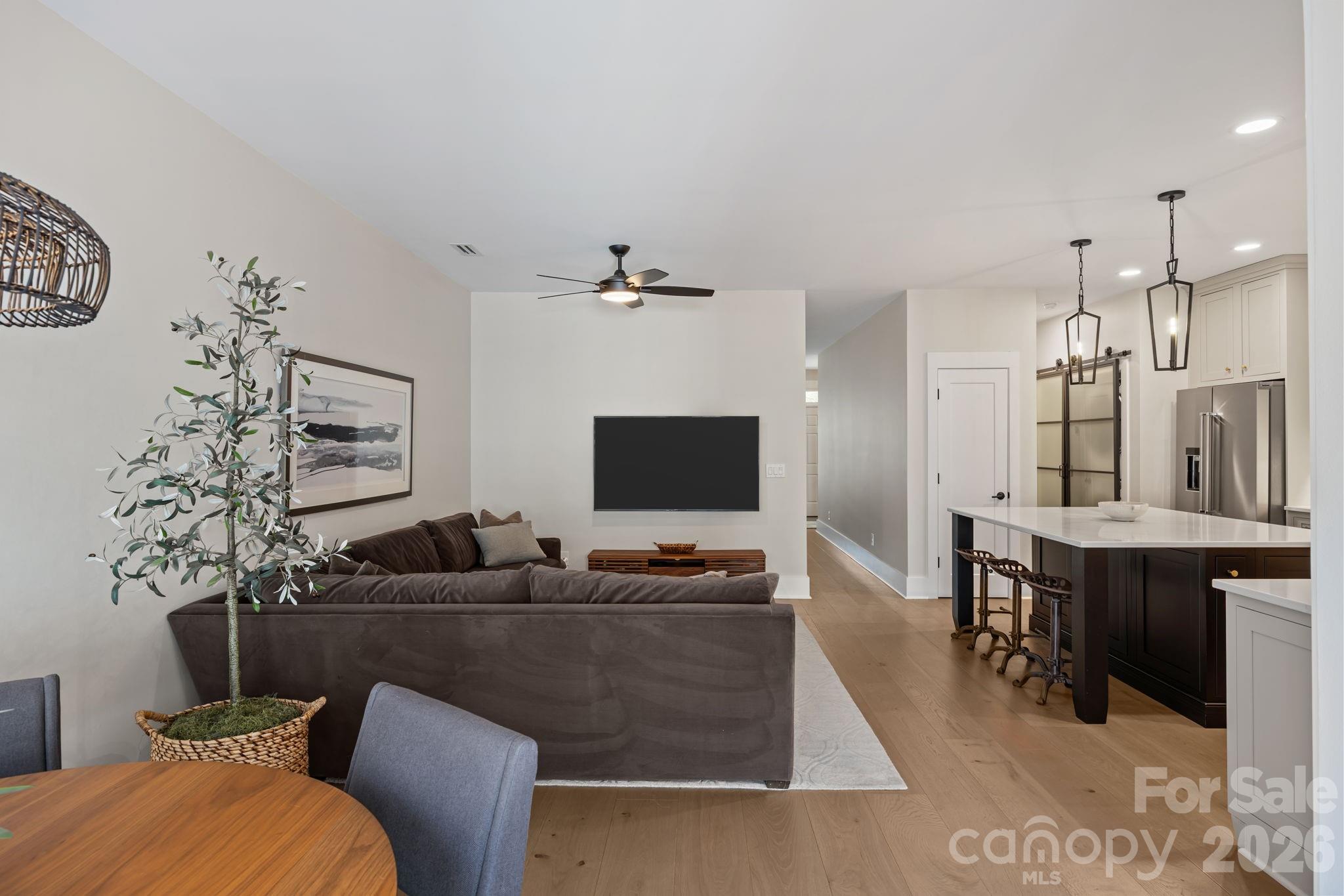 241 North Faulkner Way Davidson, NC 28036 - Photo 13 of 39 a living room with furniture and wooden floor