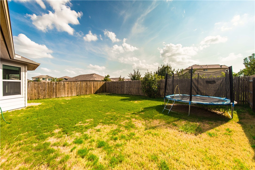 1007 Plateau Trail Georgetown, TX 78626 - Photo 30 of 32 a view of a swimming pool with a garden