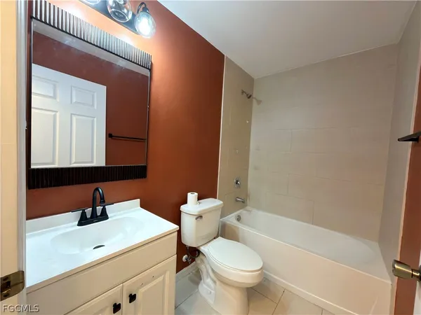 a bathroom with a sink a toilet and a bathtub