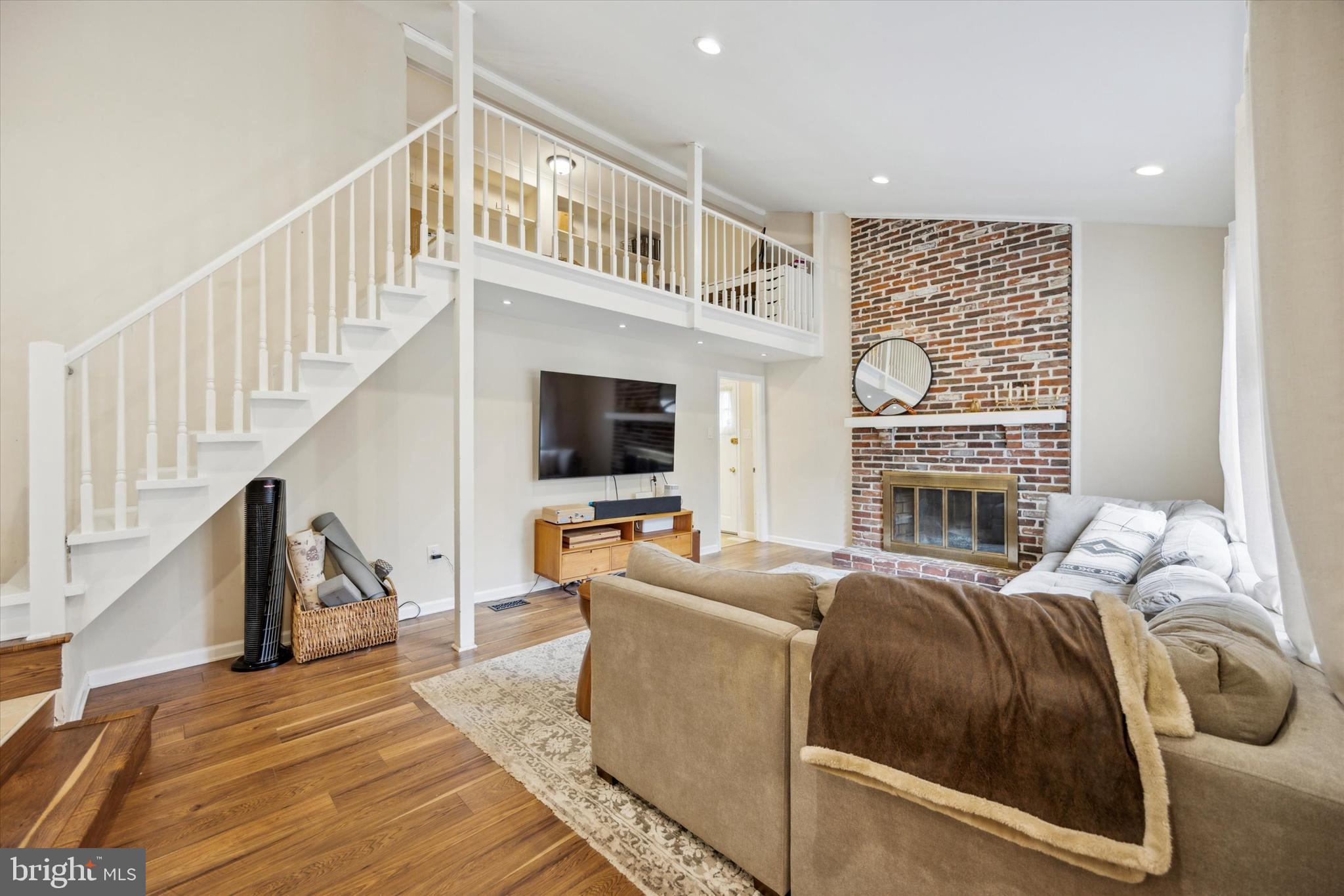 411 Silver Hill Road Cherry Hill, NJ 08002 - Photo 13 of 29 a living room with fireplace furniture and a flat screen tv