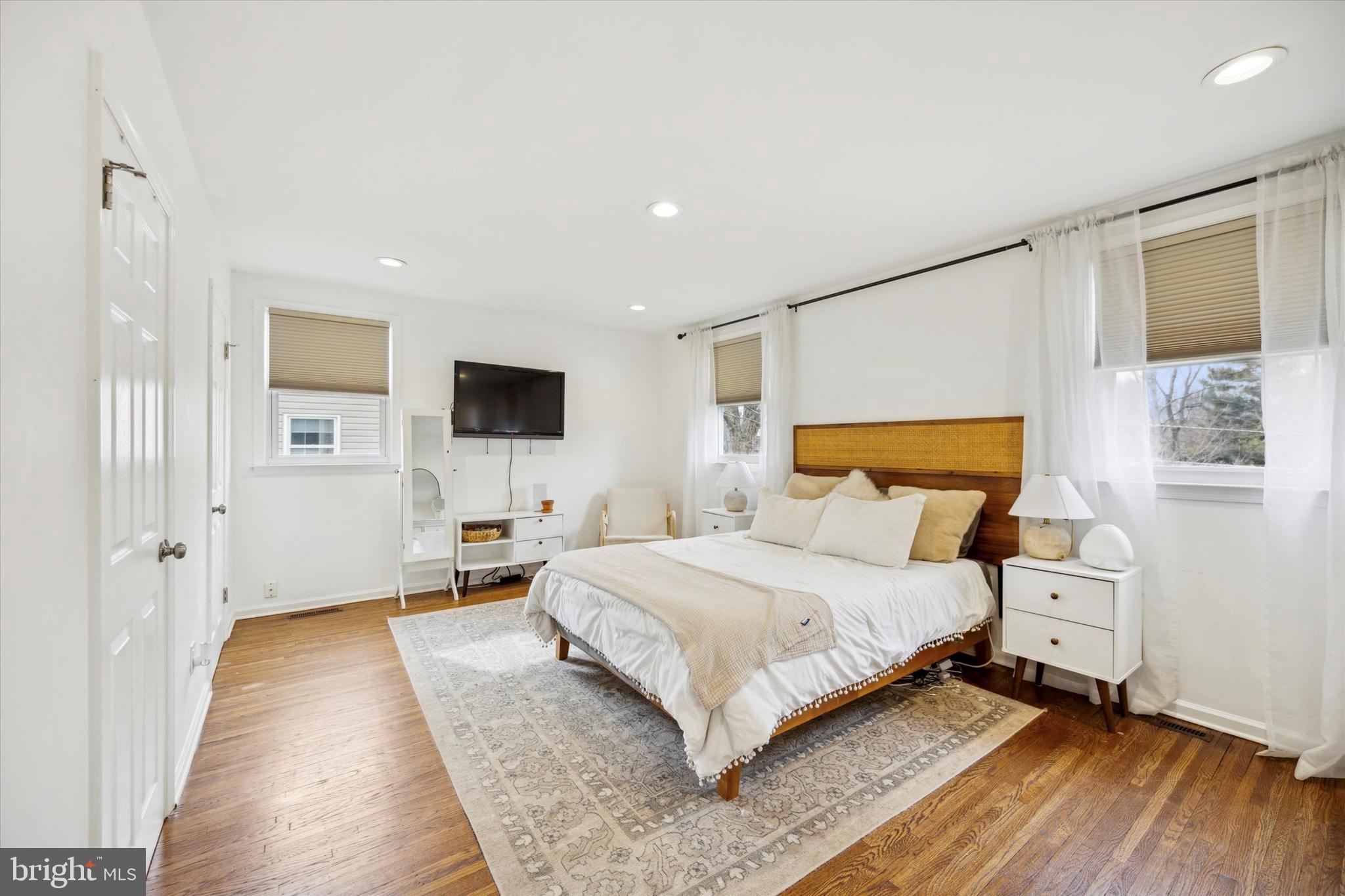 411 Silver Hill Road Cherry Hill, NJ 08002 - Photo 18 of 29 a bedroom with a bed and flat screen tv