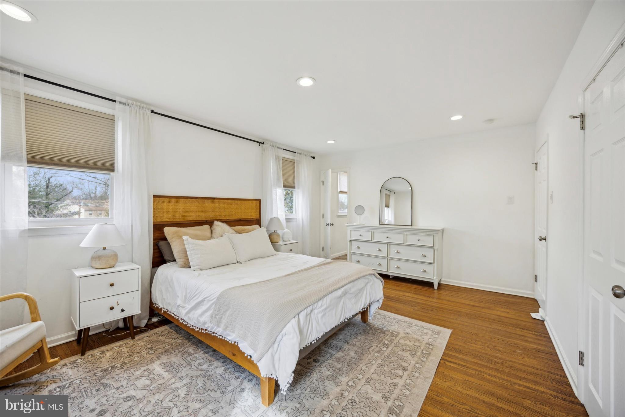 411 Silver Hill Road Cherry Hill, NJ 08002 - Photo 19 of 29 a bedroom with a bed wooden floor and window