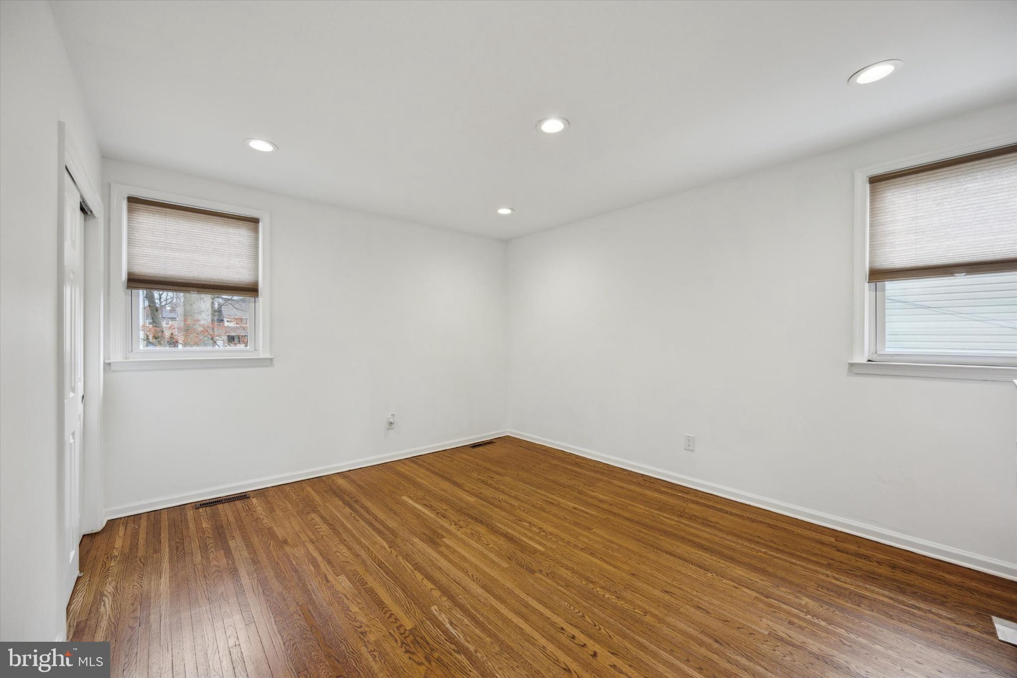 411 Silver Hill Road Cherry Hill, NJ 08002 - Photo 23 of 29 a view of empty room with wooden floor and fan