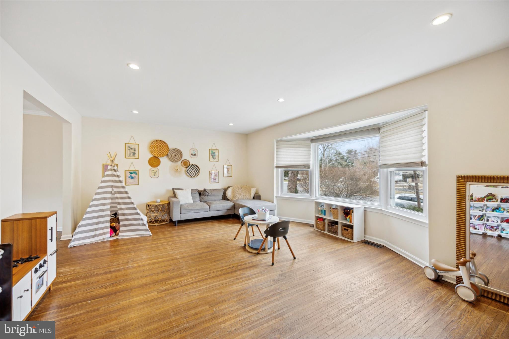 411 Silver Hill Road Cherry Hill, NJ 08002 - Photo 4 of 29 a view of a livingroom with furniture and a flat screen tv