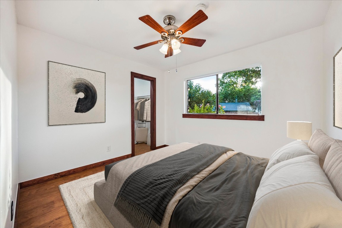 5301 Presidio Road Austin, TX 78745 - Photo 12 of 20 a bedroom with a bed and a large window
