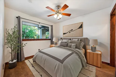 a bedroom with a bed and window