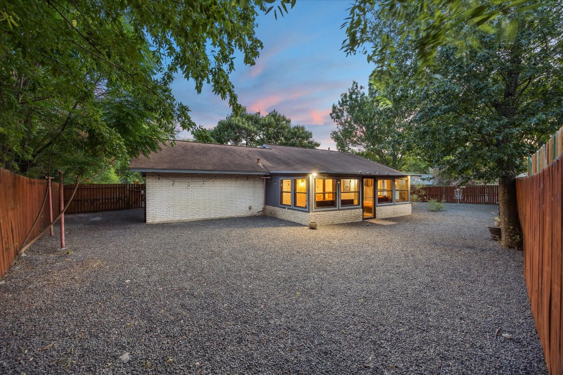 5301 Presidio Road Austin, TX 78745 - Photo 17 of 20 a view of a house with a yard and garage