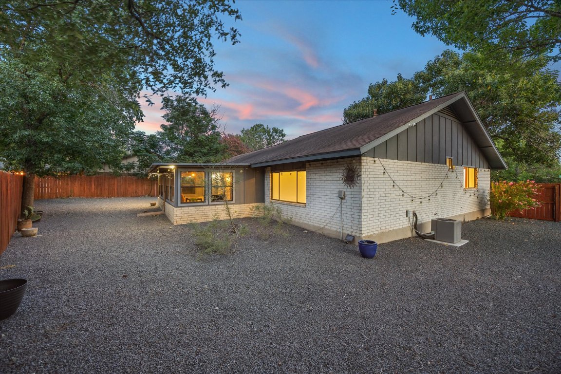 5301 Presidio Road Austin, TX 78745 - Photo 18 of 20 a view of a house with a yard and garage