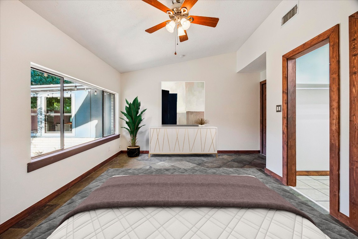 5301 Presidio Road Austin, TX 78745 - Photo 10 of 20 a view of a hallway with a window and wooden floor