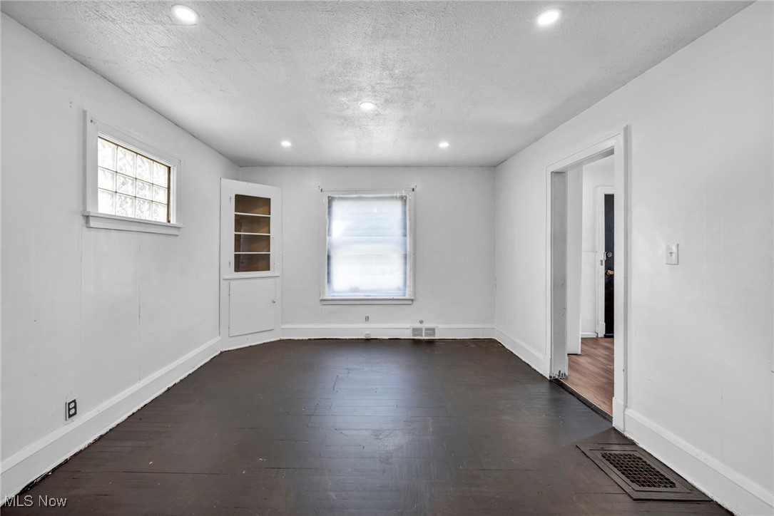1743 Clarkstone Road Cleveland, OH 44112 - Photo 9 of 24 Dining room featuring dark wood flooring