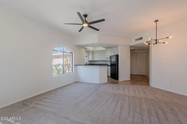 a view of a kitchen with a dishwasher cabinets and a wooden floor