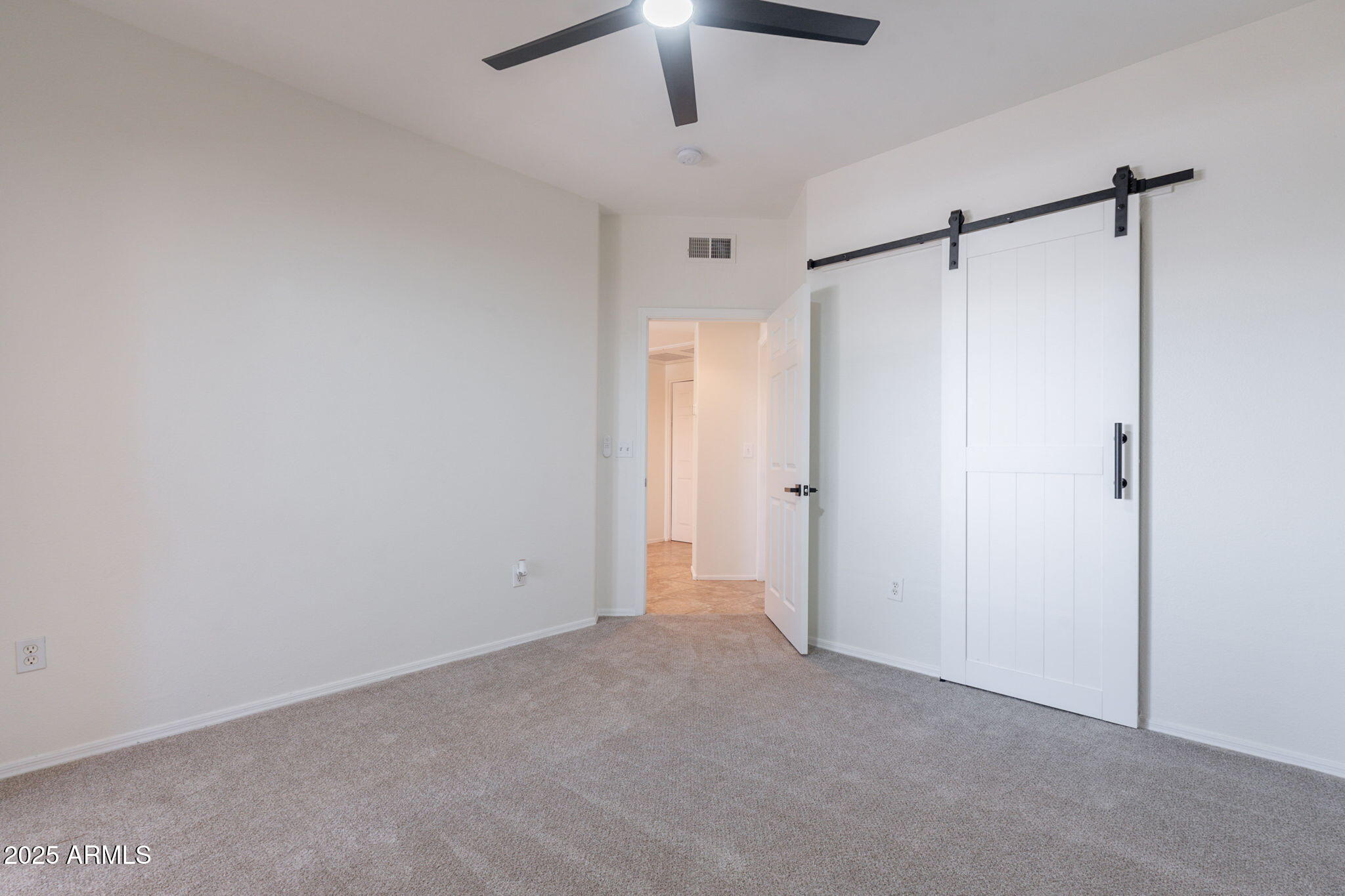 10030 West Indian School Road, Unit 218 Phoenix, AZ 85037 - Photo 15 of 28 a view of an empty room