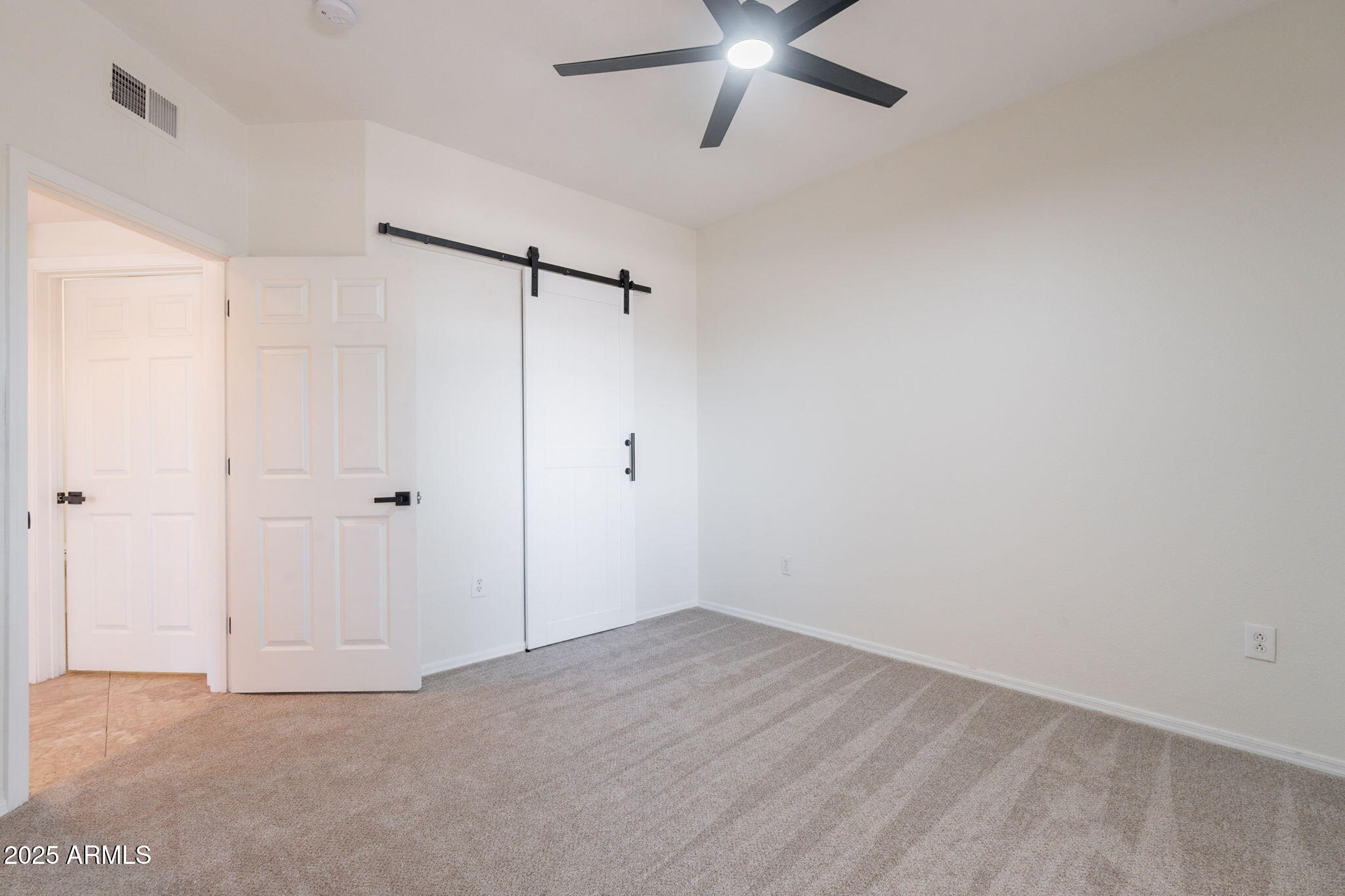 10030 West Indian School Road, Unit 218 Phoenix, AZ 85037 - Photo 16 of 28 a view of an empty room