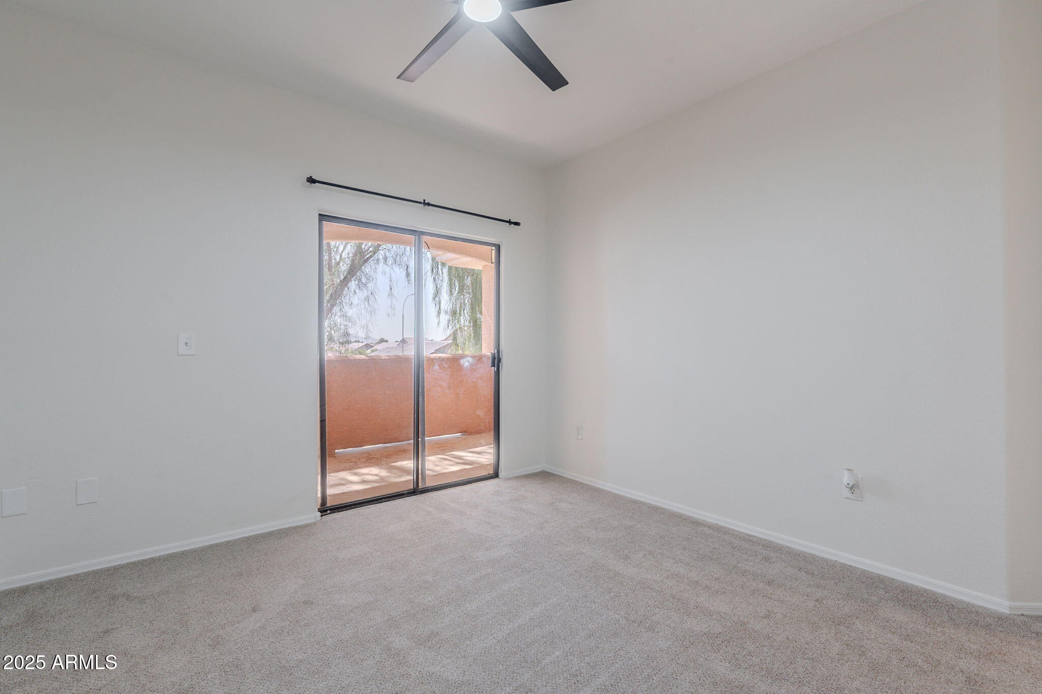 10030 West Indian School Road, Unit 218 Phoenix, AZ 85037 - Photo 18 of 28 an empty room with windows