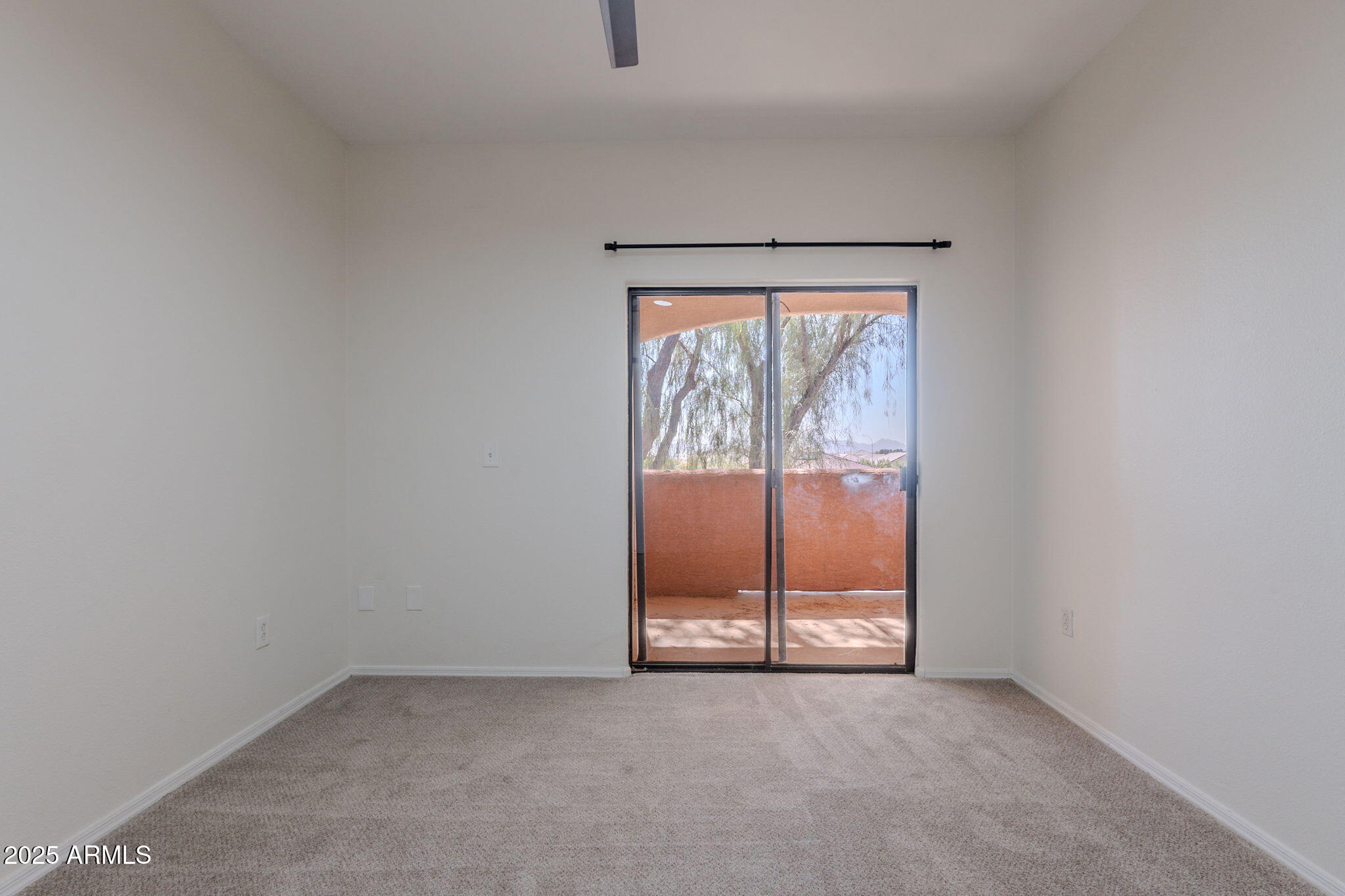 10030 West Indian School Road, Unit 218 Phoenix, AZ 85037 - Photo 19 of 28 an empty room with large window