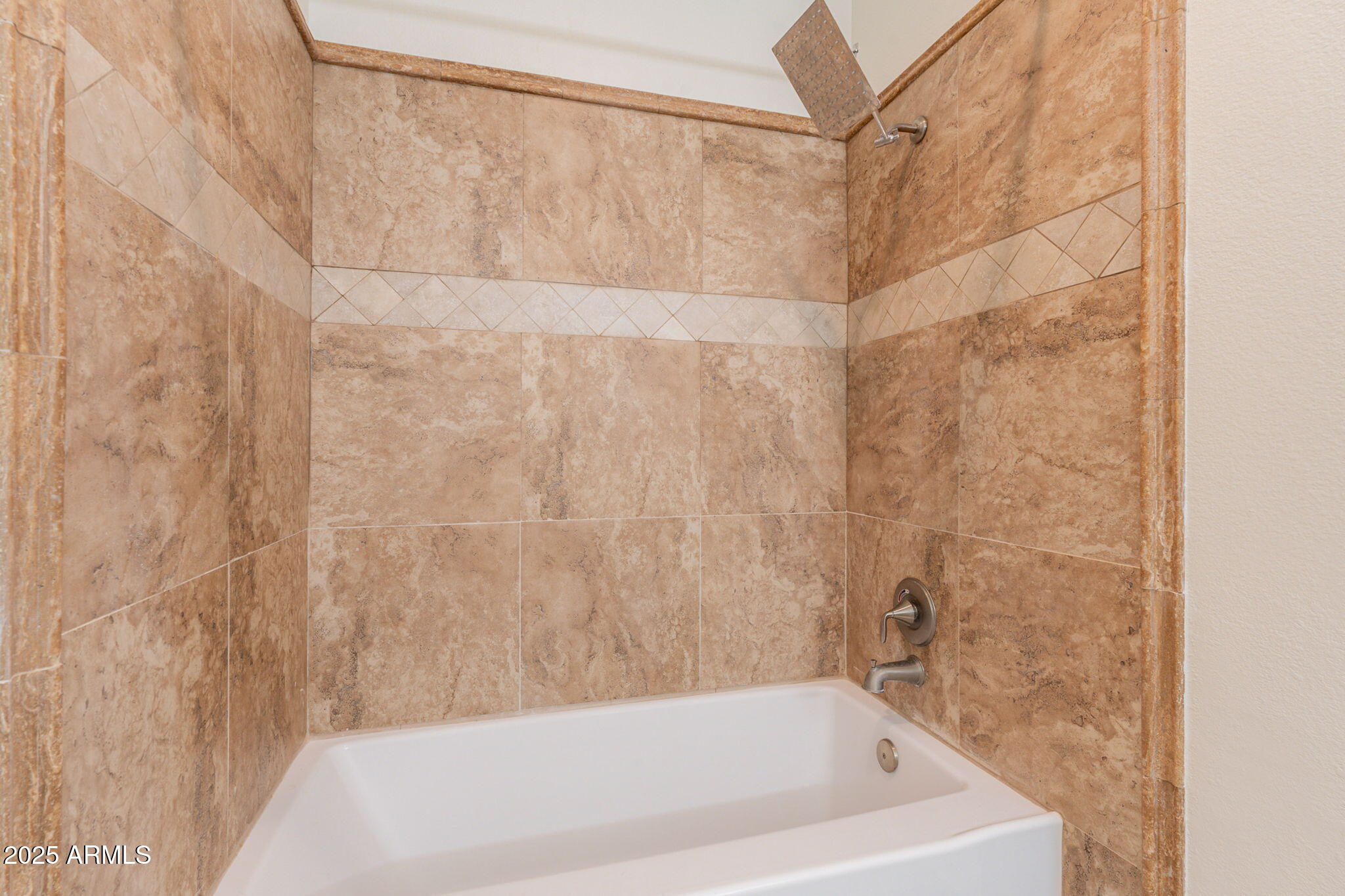 10030 West Indian School Road, Unit 218 Phoenix, AZ 85037 - Photo 22 of 28 a bathroom with a bathtub