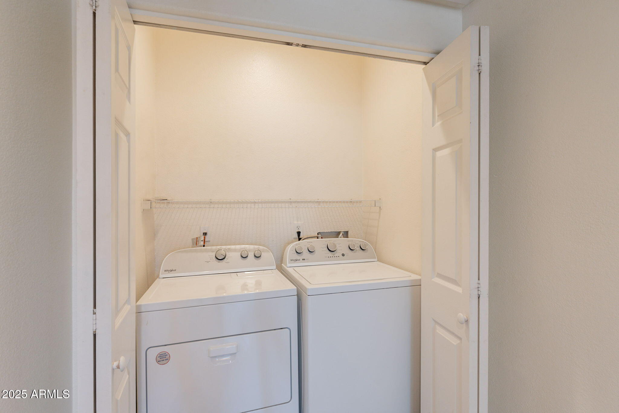 10030 West Indian School Road, Unit 218 Phoenix, AZ 85037 - Photo 23 of 28 a utility room with dryer and washer