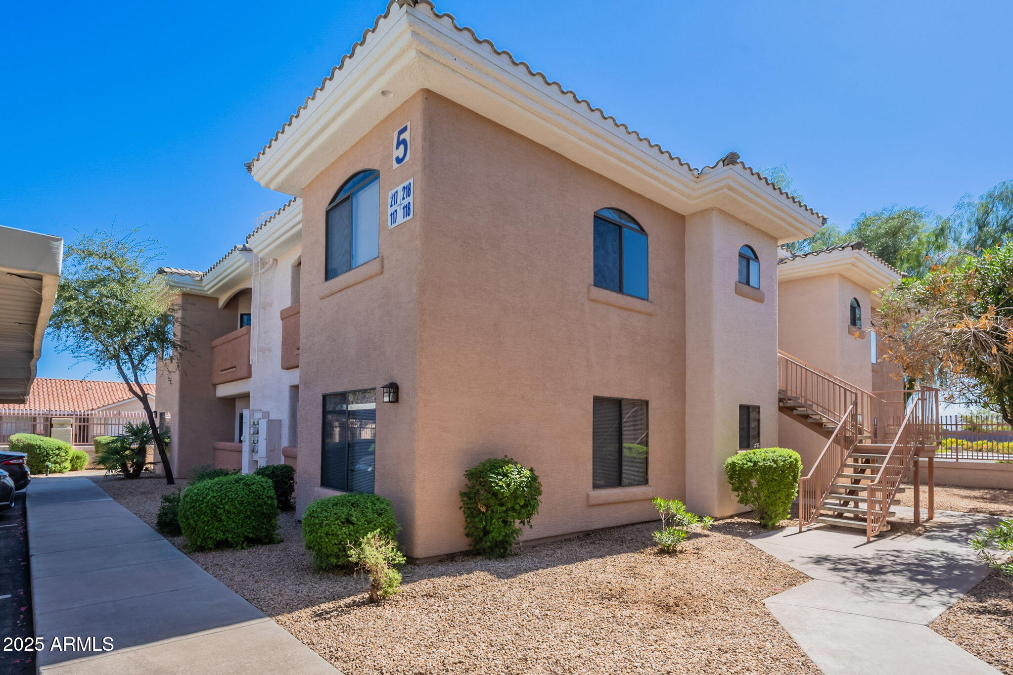 10030 West Indian School Road, Unit 218 Phoenix, AZ 85037 - Photo 25 of 28 a view of a house with a yard