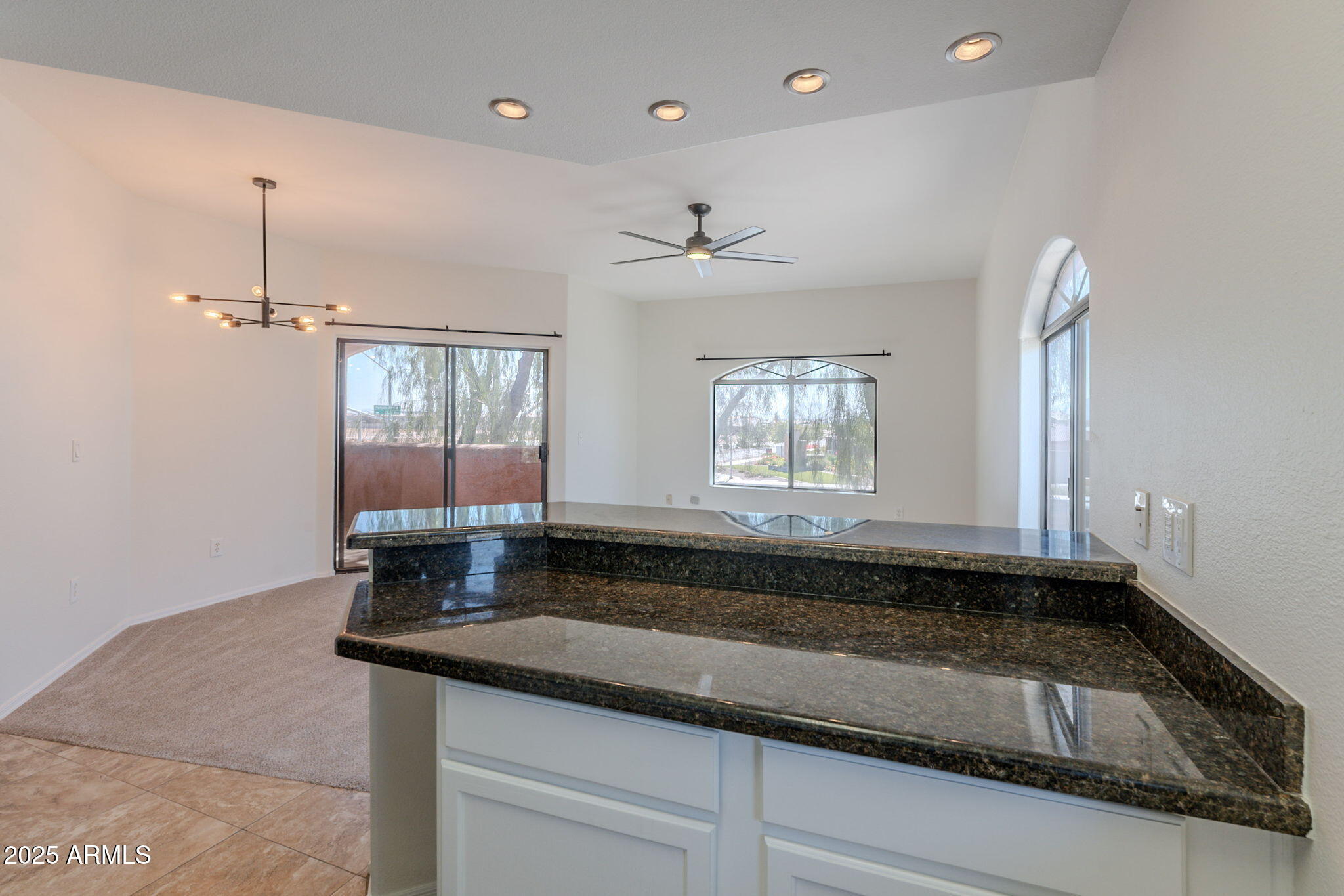 10030 West Indian School Road, Unit 218 Phoenix, AZ 85037 - Photo 7 of 28 a bathroom with a sink and a mirror