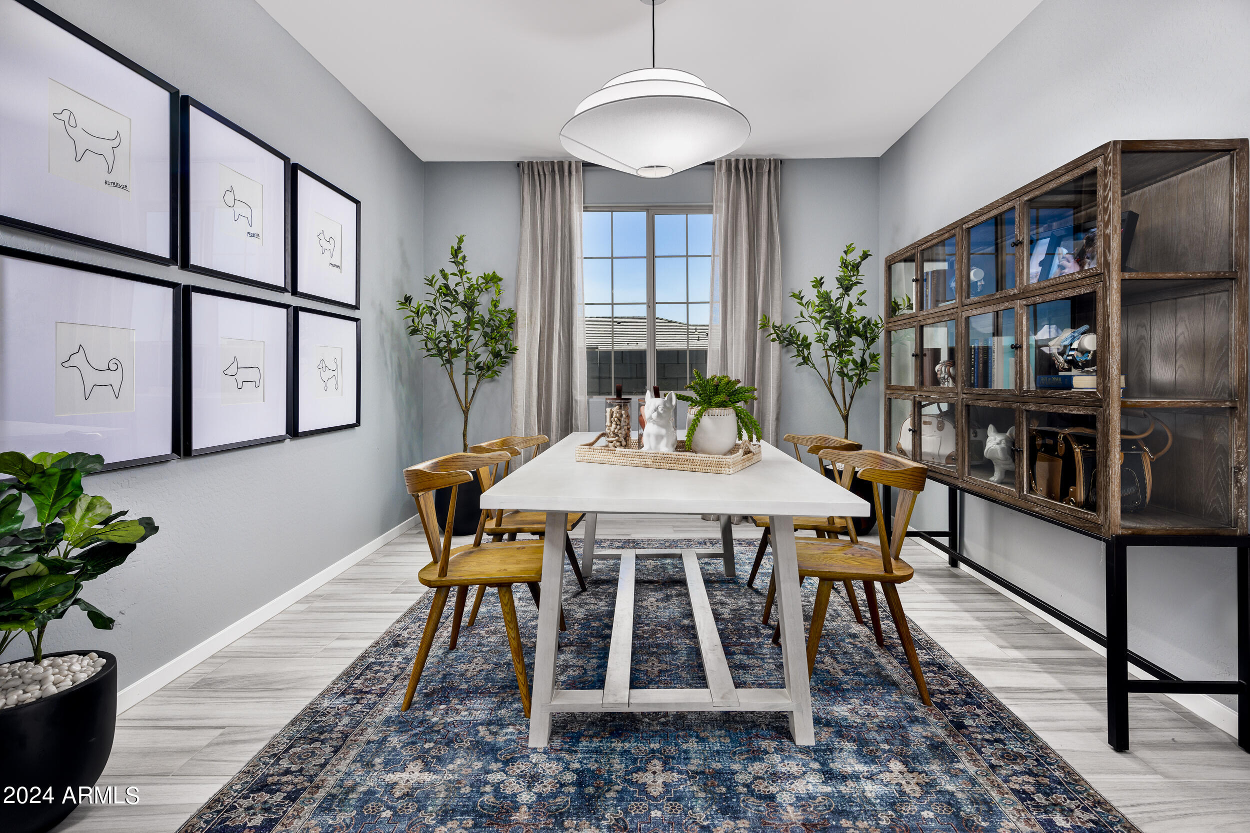 1121 Arastra Way Apache Junction, AZ 85120 - Photo 9 of 45 a view of a dining room with furniture window and wooden floor