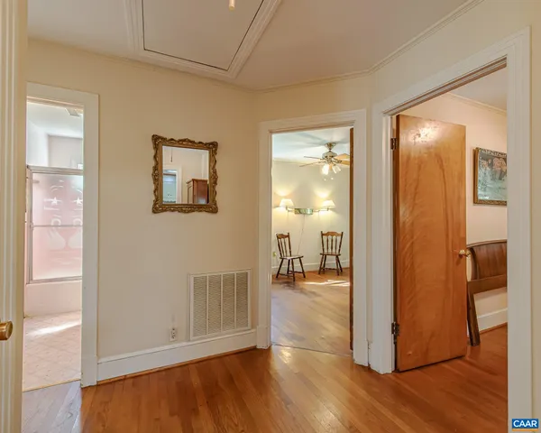 a kitchen with stainless steel appliances granite countertop a refrigerator a stove and a sink with wooden cabinets