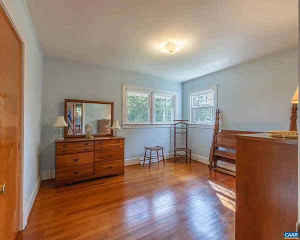 a view of room with wooden floor