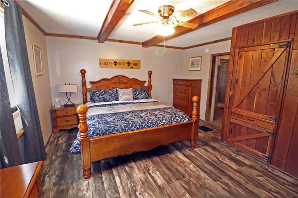 2 Miller Road Mill Run, PA 15464 - Photo 11 of 21 a bed sitting in a bedroom next to a window