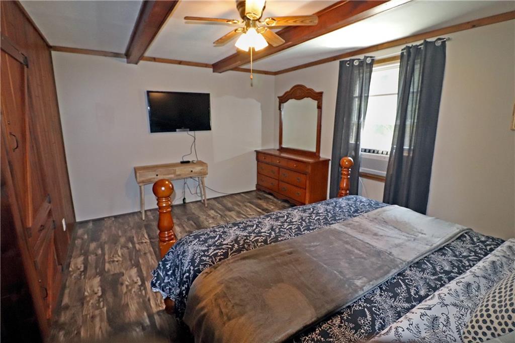 2 Miller Road Mill Run, PA 15464 - Photo 12 of 21 a bedroom with a bed and a flat screen tv