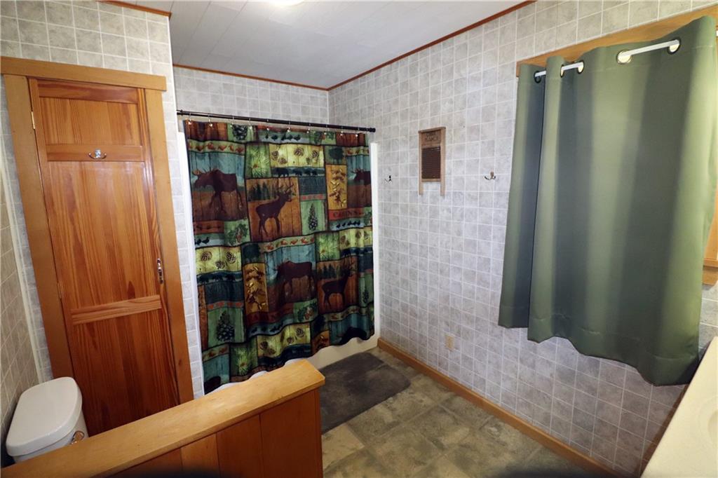 2 Miller Road Mill Run, PA 15464 - Photo 13 of 21 a bedroom with a bed and a window