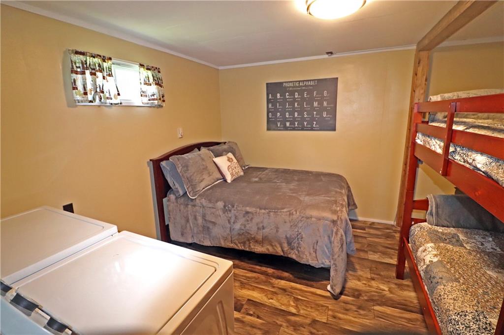 2 Miller Road Mill Run, PA 15464 - Photo 16 of 21 a bedroom with a bed and cabinets