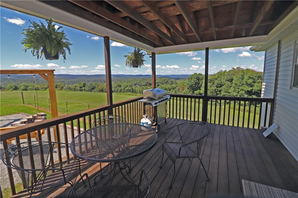 2 Miller Road Mill Run, PA 15464 - Photo 3 of 21 a view of a porch with a table