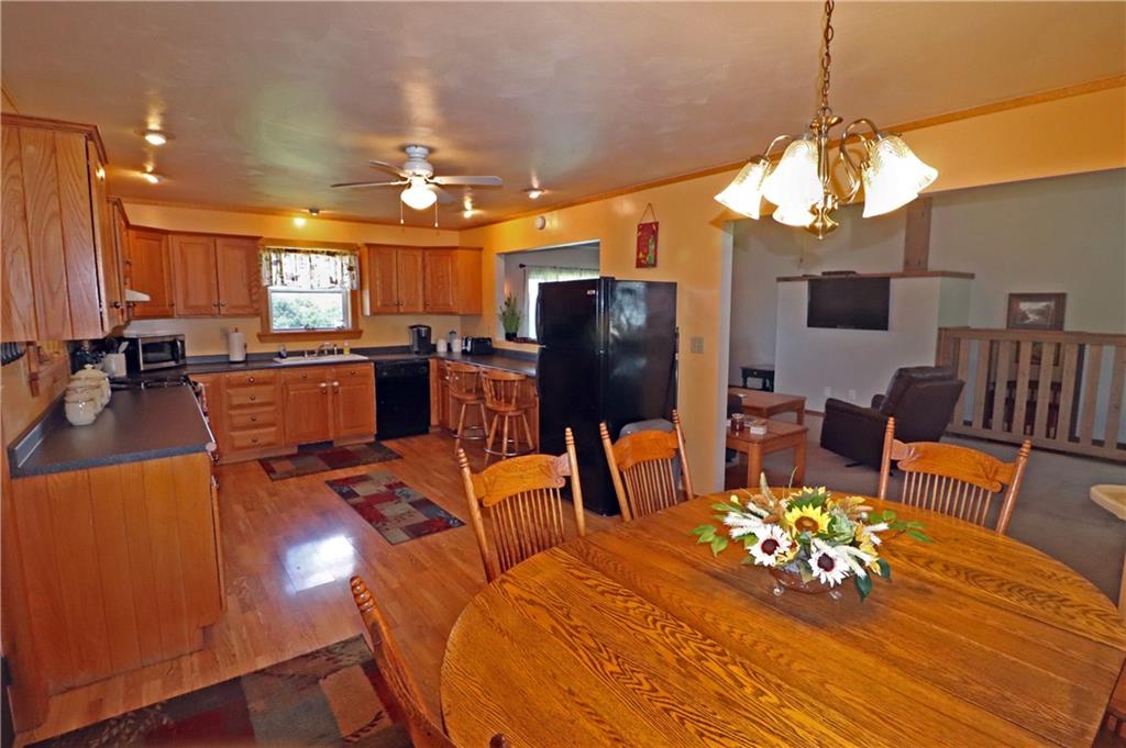 2 Miller Road Mill Run, PA 15464 - Photo 4 of 21 a view of a dining room with furniture a chandelier and wooden floor