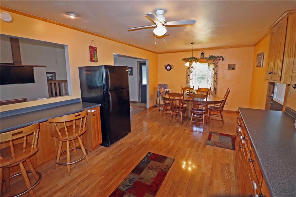 2 Miller Road Mill Run, PA 15464 - Photo 5 of 21 a view of a dining room with furniture window and wooden floor