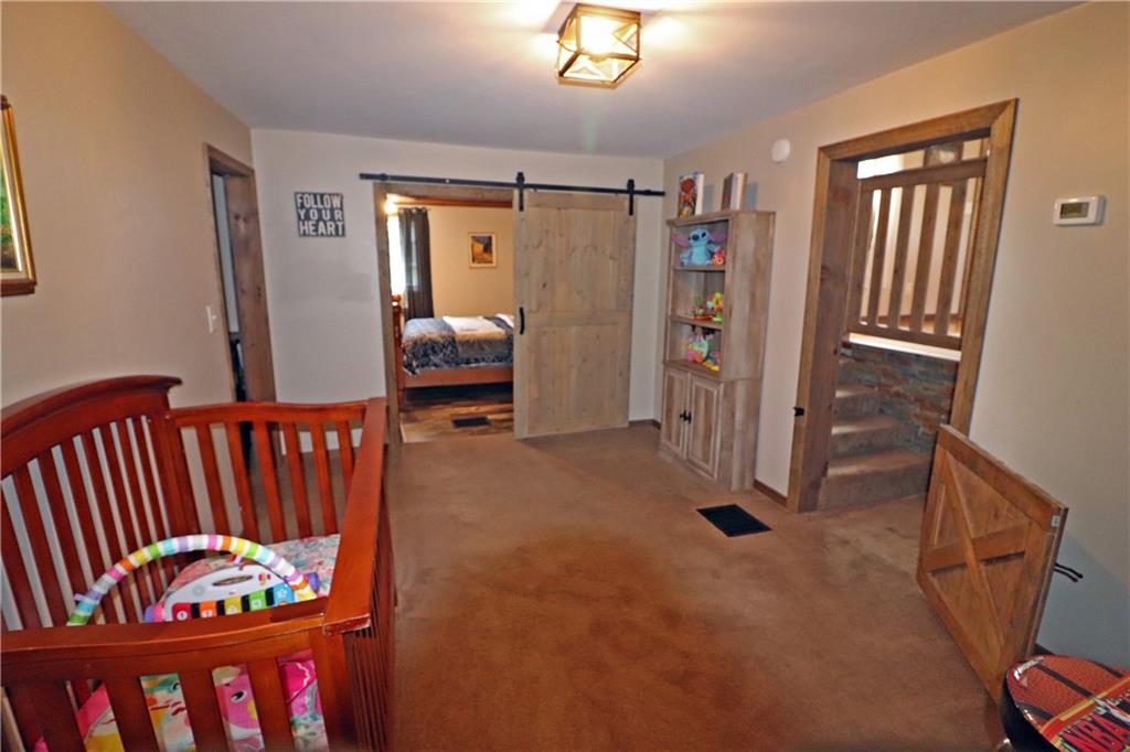 2 Miller Road Mill Run, PA 15464 - Photo 10 of 21 a bedroom with furniture and a window