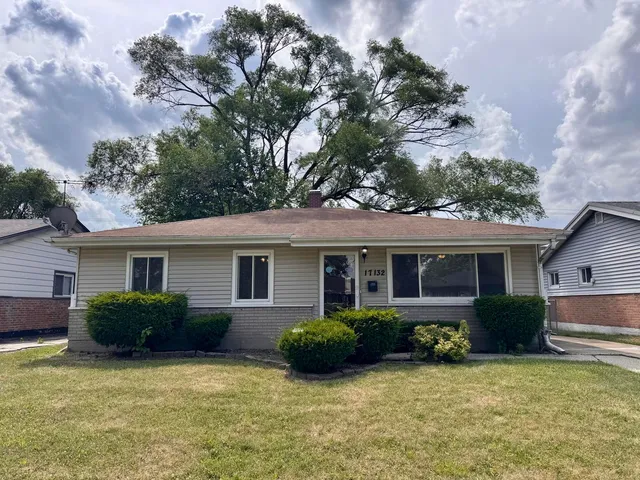front view of a house with a yard