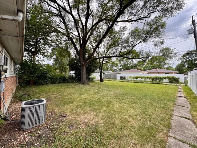 a view of a backyard with a small cabin