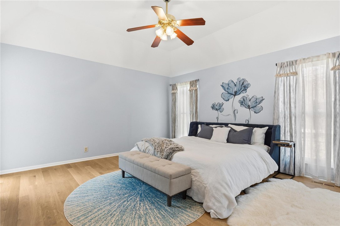8781 Rupp Farm Drive West Chester, OH 45069 - Photo 30 of 48 This spacious bedroom features beautiful hardwood flooring and ample natural light.