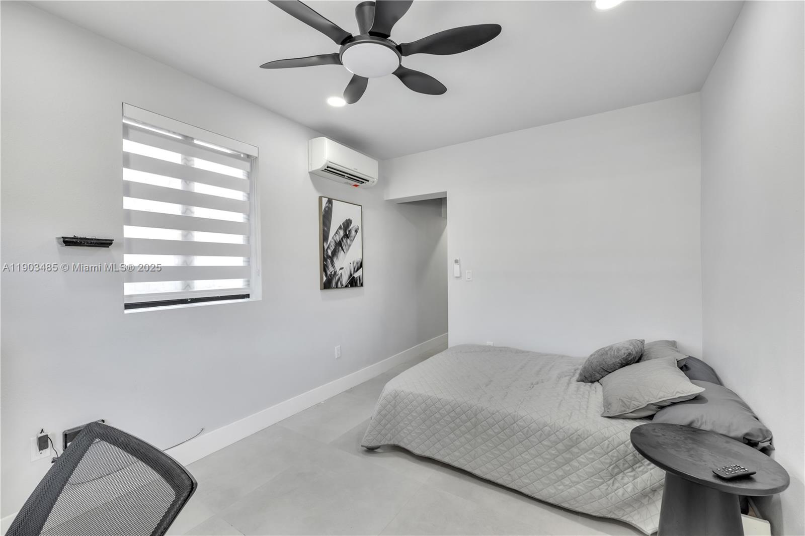 6021 Southwest 19th Street Miami, FL 33155 - Photo 15 of 20 a bedroom with a bed and a chandelier