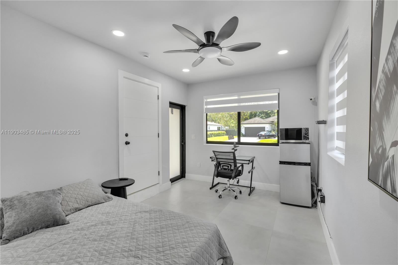 6021 Southwest 19th Street Miami, FL 33155 - Photo 17 of 20 a bedroom with furniture and a window