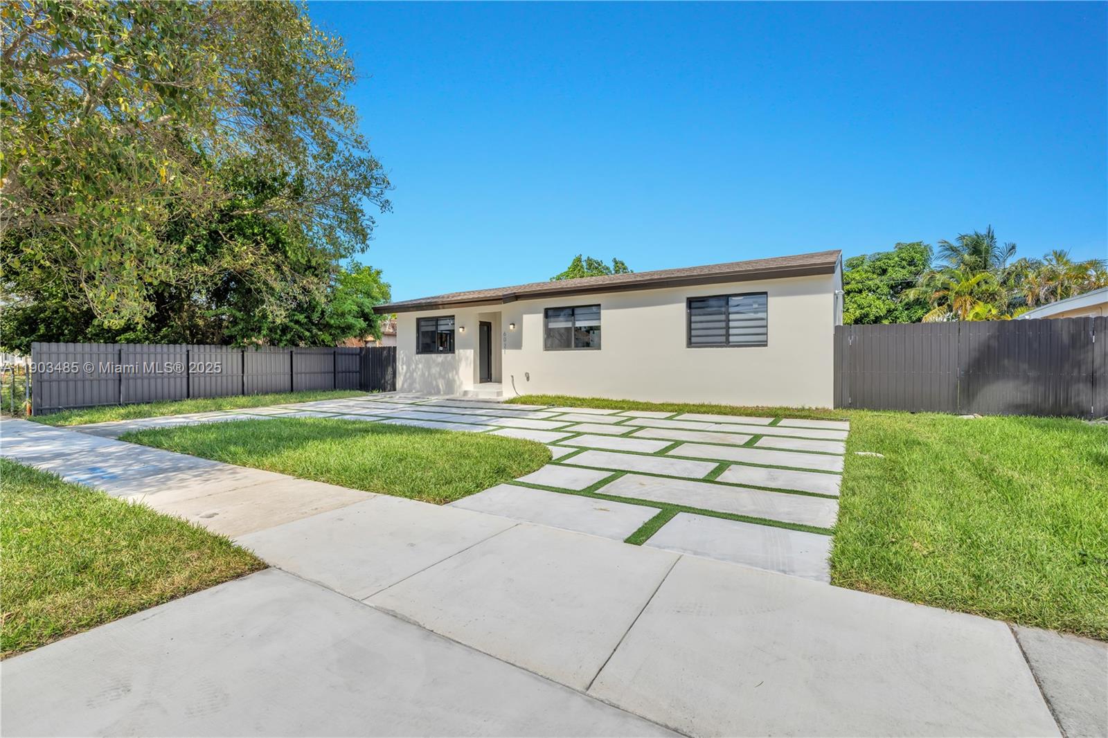 6021 Southwest 19th Street Miami, FL 33155 - Photo 2 of 20 a view of house with backyard outdoor seating and green space